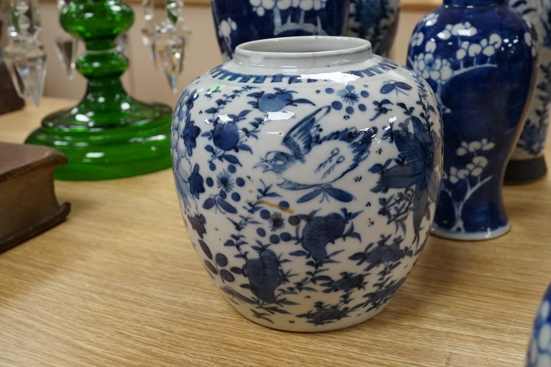 Chinese blue and white porcelain, late 19th century, comprising two prunus vases, two crackle glaze vases and a 'Bird and Flowers' jar, tallest crackle glaze vases 23cm